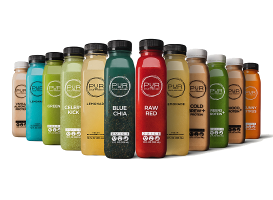 Row of PUR Juice bottles in various flavors on a white background