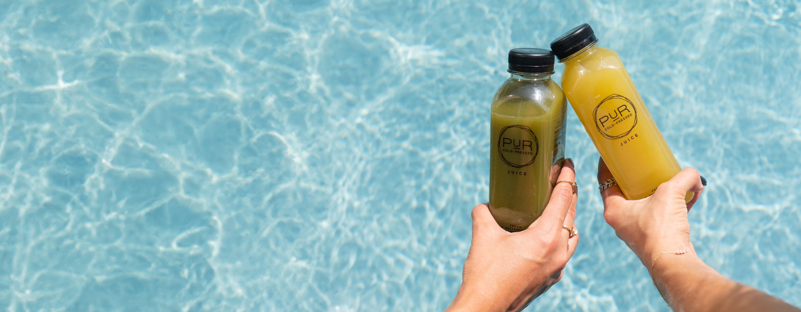 Poolside with PUR Cold-Pressed juices – fresh, vibrant, and hydrating.
