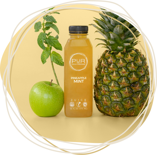 PUR Cold-Pressed Pineapple Mint juice with fresh pineapple, green apple, and mint leaves in a PUR circular frame.