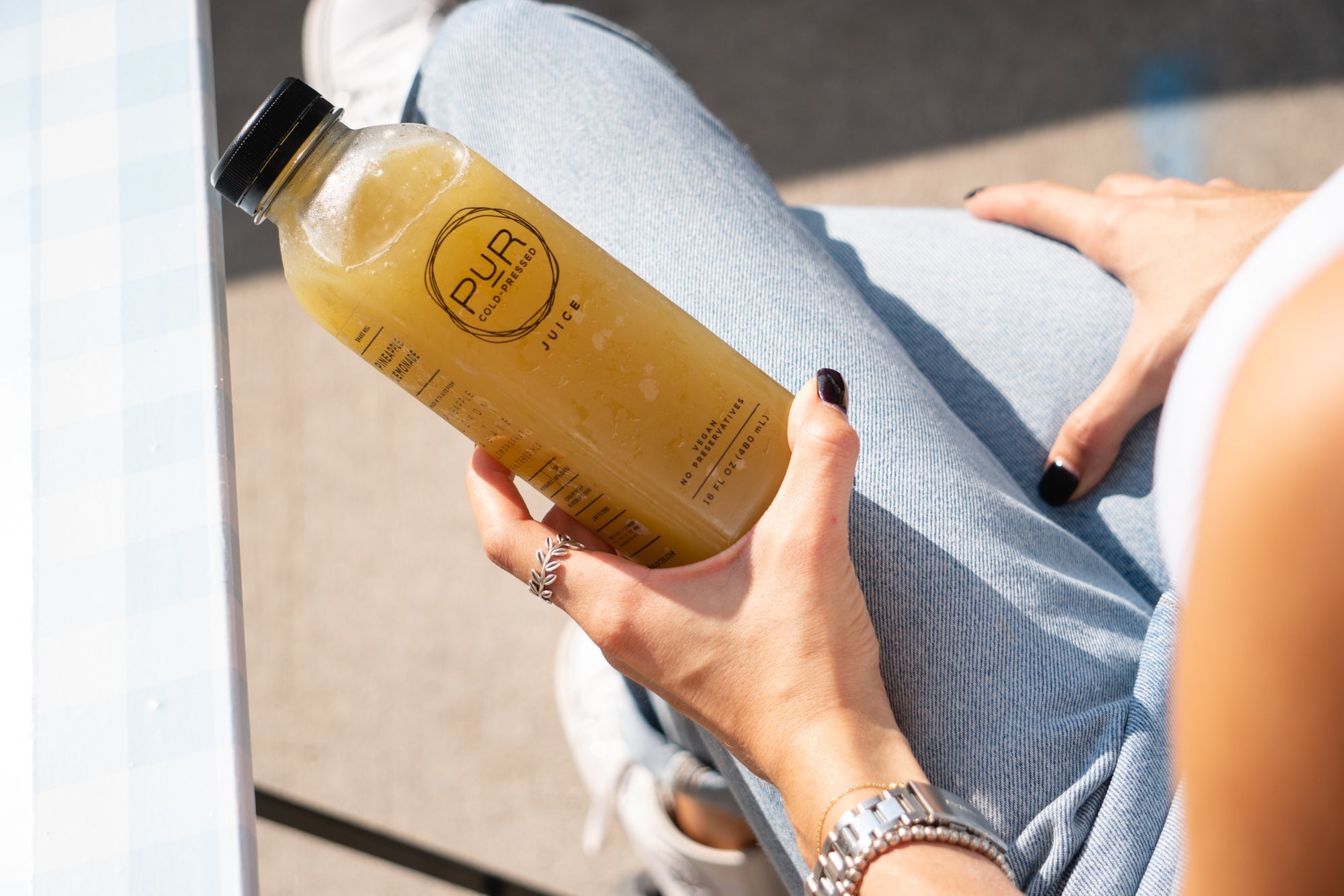 Girl holding a PUR juice