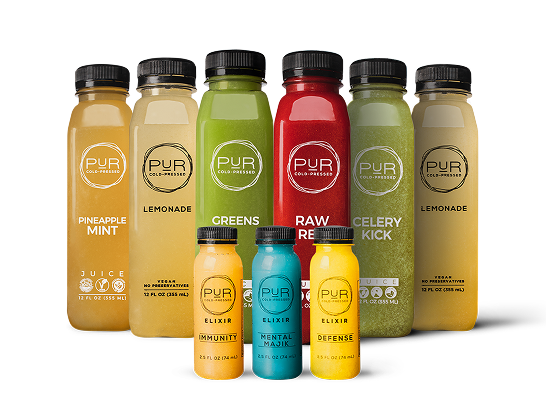 Assorted bottles of PUR cold-pressed juices on a white background