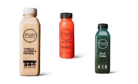 Three bottles of PUR juice on a white background
