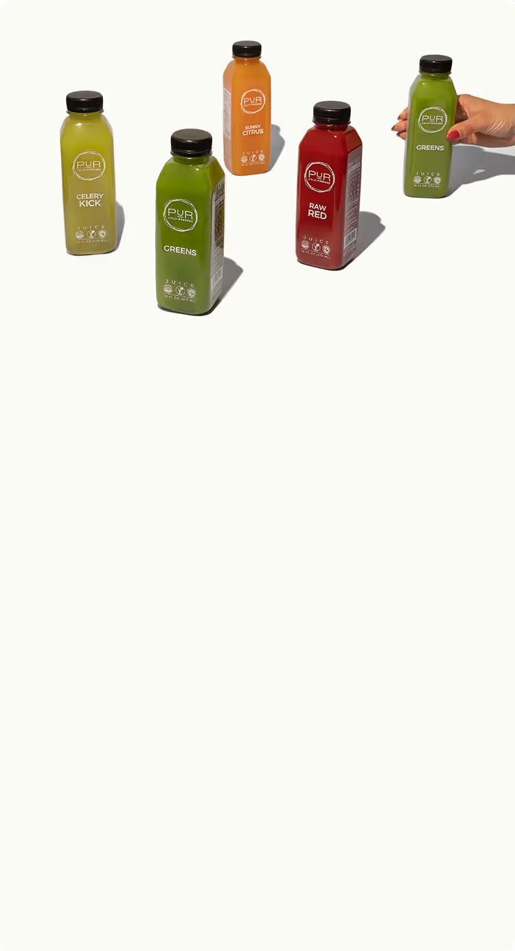 PUR cold-pressed wellness juices displayed in the homepage hero section